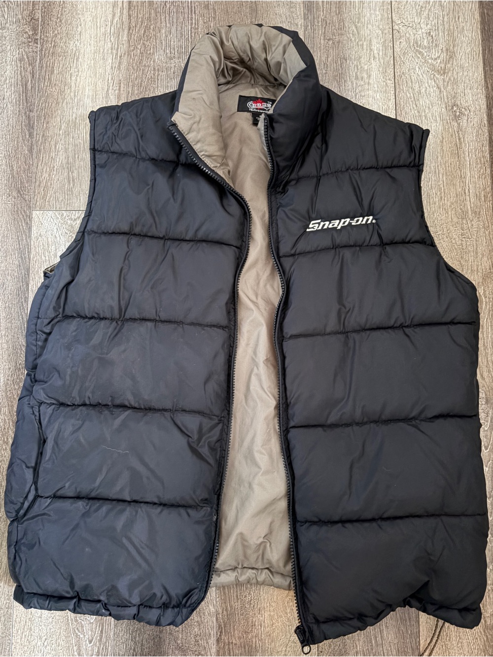 Snap black quilted puffer vest with tan lining